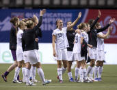 VANCOUVER, CANADA - JANUARY 27: Members of team United States salute their fans after defeating Costa Rica 3-0 during semifinals action of the 2012 CONCACAF Women's Olympic Qualifying Tournament at BC Place on January 27, 2012 in Vancouver, British Columbia, Canada. The United States have now qualified for the 2012 Summer Olympic Games in London. (Photo by Rich Lam/Getty Images)