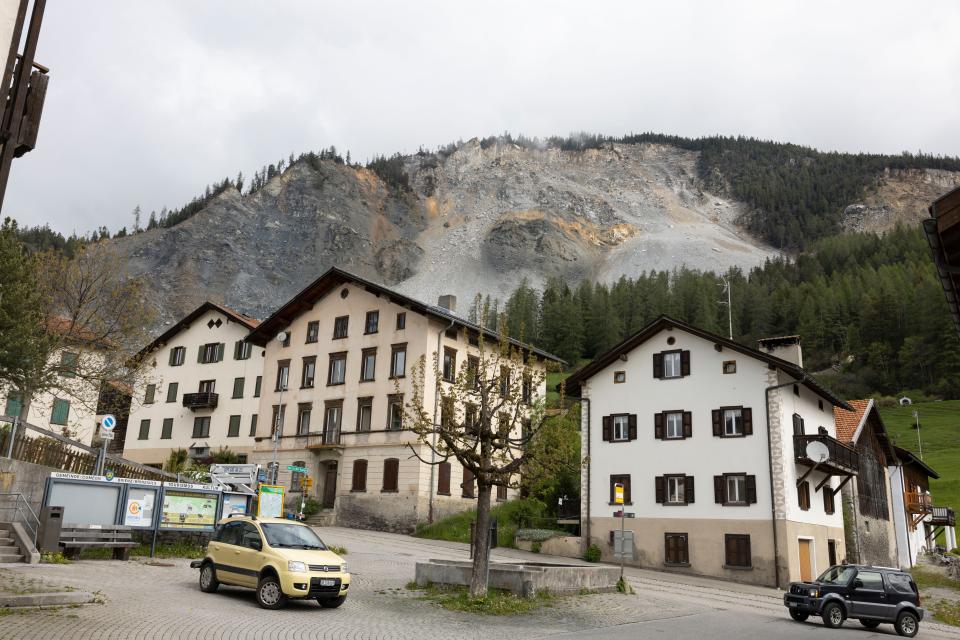 rocks on a mountainside threaten houses in Brienz-Brinzauls, Switzerland