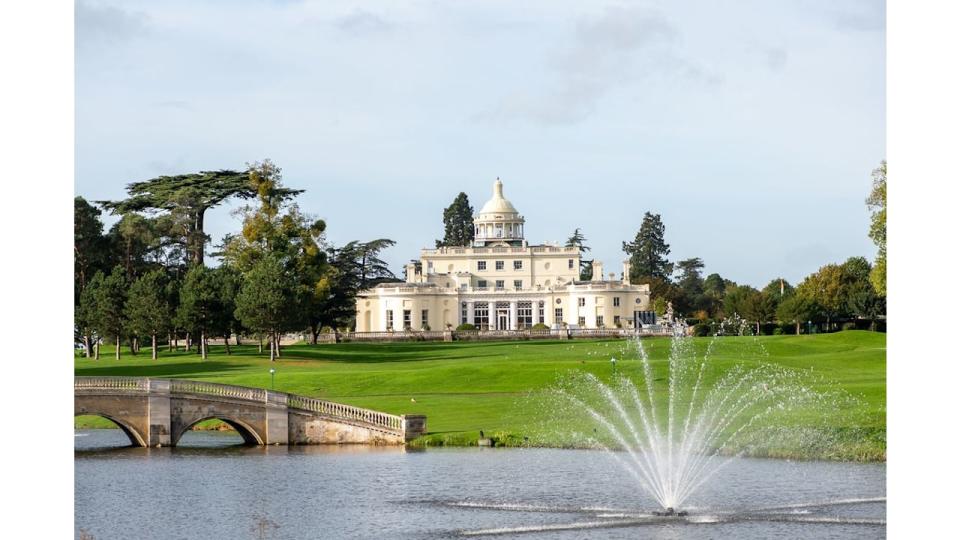 Stoke Park mansion house with a fountain and a bridge