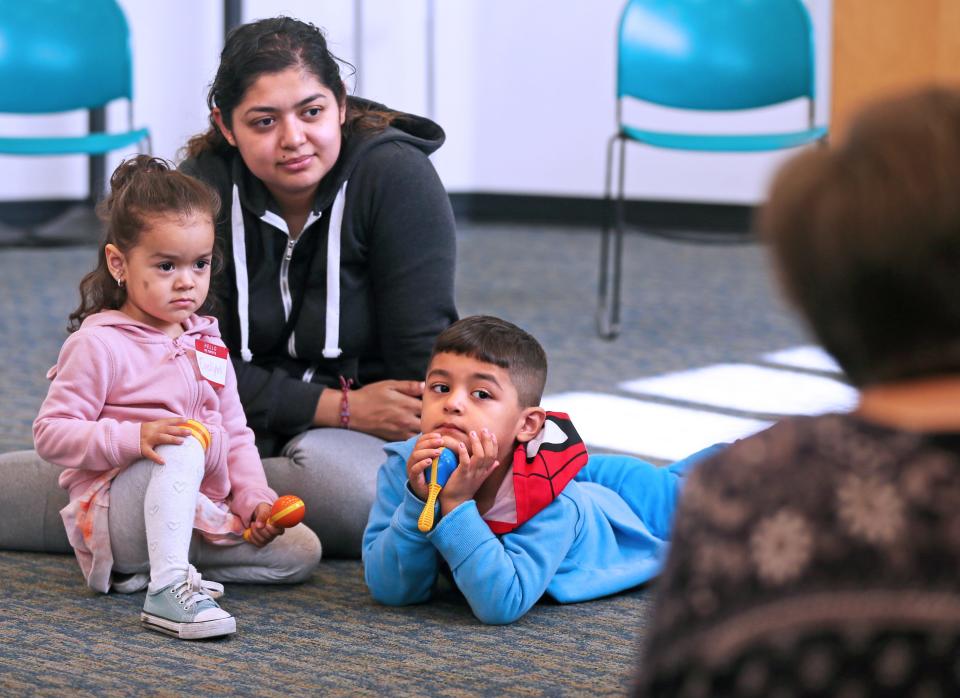 Griselda Contreras and her children Evelyn, 2 and Emmanuel, 3, right, participate in family storytime at Zablocki Library on Thursday, Sept. 29, 2022 at 3501 W Oklahoma Ave., in Milwaukee. Contreras and her family are regulars for the storytime at the library.