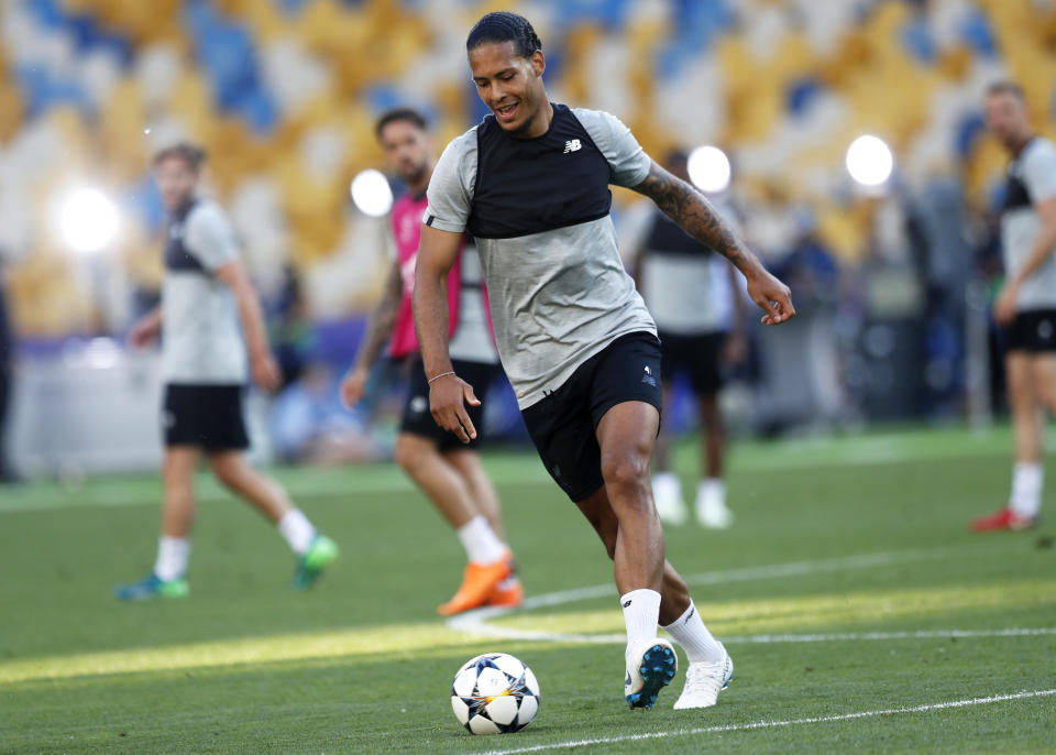 FILE - In this file photo dated Friday, May 25, 2018, Liverpool's Virgil van Dijk runs with the ball during a training session at the Olimpiyskiy Stadium in Kiev, Ukraine. There’s a new-found robustness to Juergen Klopp’s team, as the opening weeks of the English Premier League season have demonstrated, conceding just 10 goals since Virgil van Dijk started playing for the team and with 11 clean sheets. (AP Photo/Pavel Golovkin, FILE)