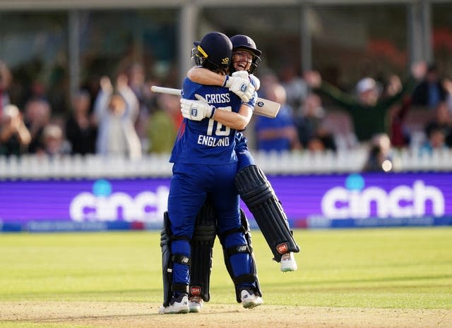 England&#x002019;s Heather Knight (right) and Kate Cross celebrates victory