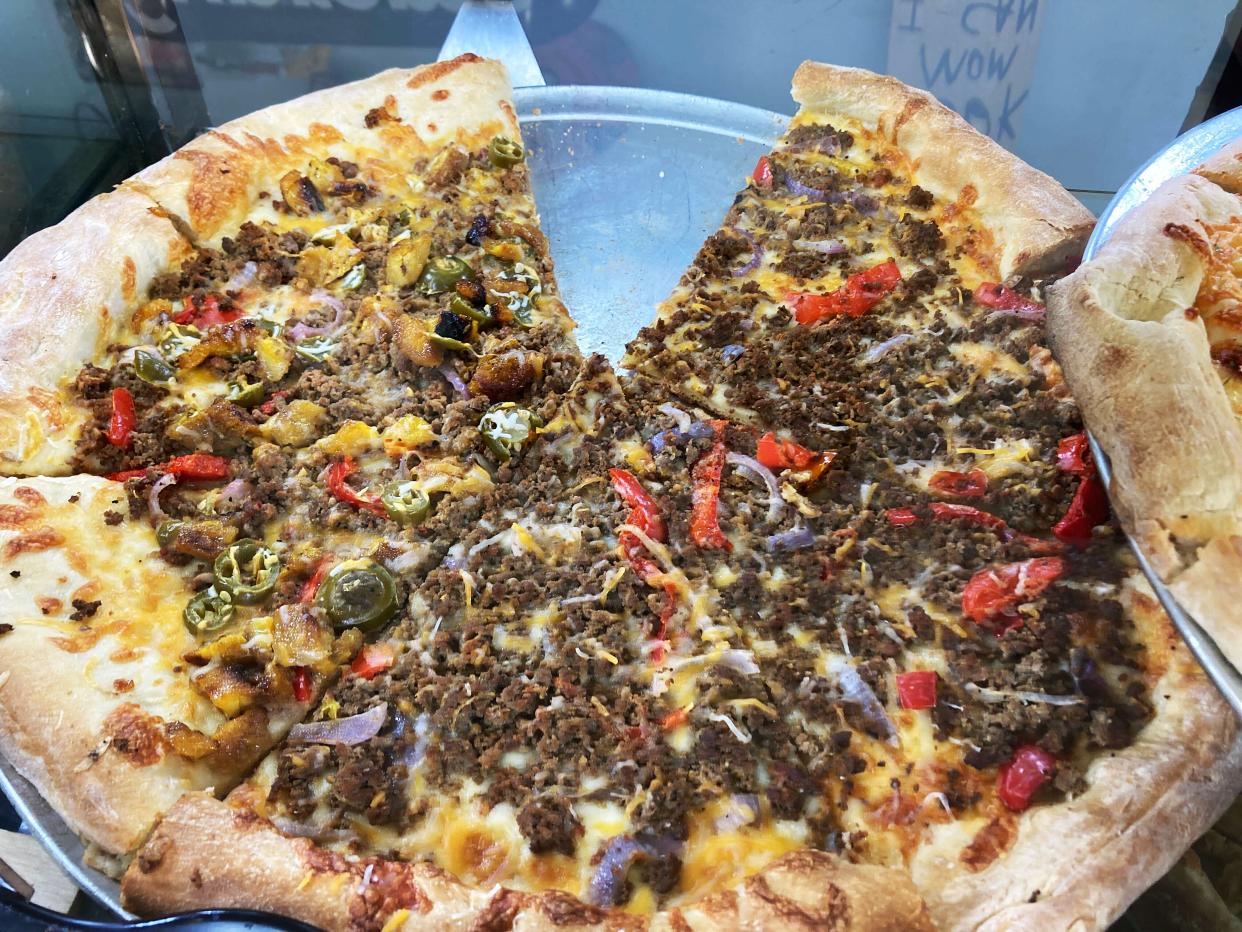 Cuts & Slices offers unusual toppings: The Tulum pie, inspired by a recent vacation to the exclusive Mexican resort destination, was designed by Randy Mclaren's wife Ashlee.  It's topped with ground beef, jalapenos, fried ripe sweet plantains and Mexican cheese.