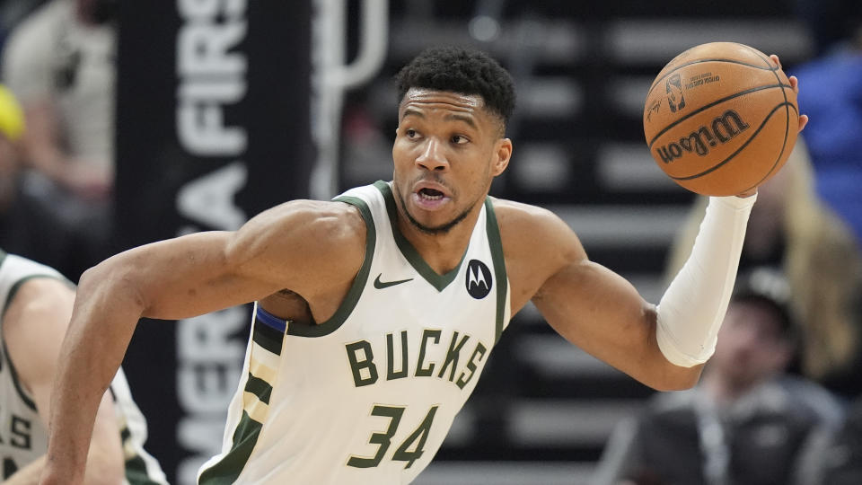 Milwaukee Bucks forward Giannis Antetokounmpo (34) brings the ball upcourt during the second half of an NBA basketball game against the Utah Jazz, Sunday, Feb. 4, 2024, in Salt Lake City. (AP Photo/Rick Bowmer)