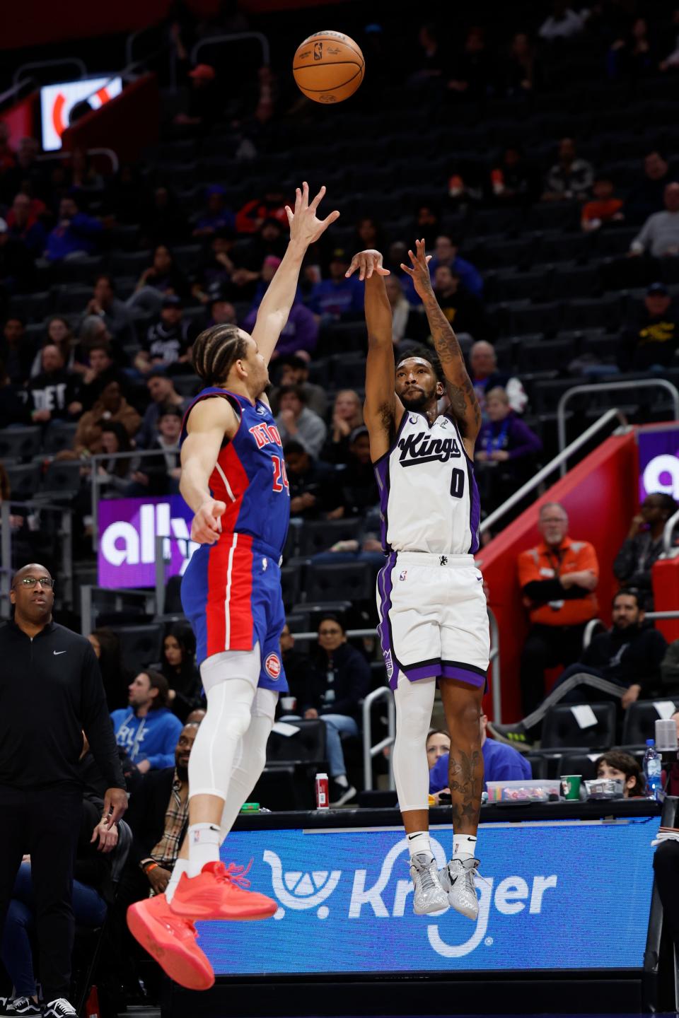 Sacramento Kings guard Malik Monk (0) shoots on Detroit Pistons forward Kevin Knox II (24) in the first half at Little Caesars Arena in Detroit on Tuesday, Jan. 9, 2024.