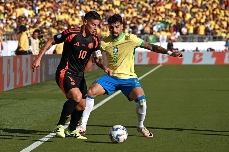 Colombia midfielder James Rodriguez (10) fights for the ball with Brazil midfielder Lucas Paqueta (8) during the CONMEBOL 2024 Copa America tournament Group D match between Brazil and Colombia at Levi’s Stadium in Santa Clara, California, on July 2, 2024. (Patrick T. Fallon/AFP/Getty Images/TNS)