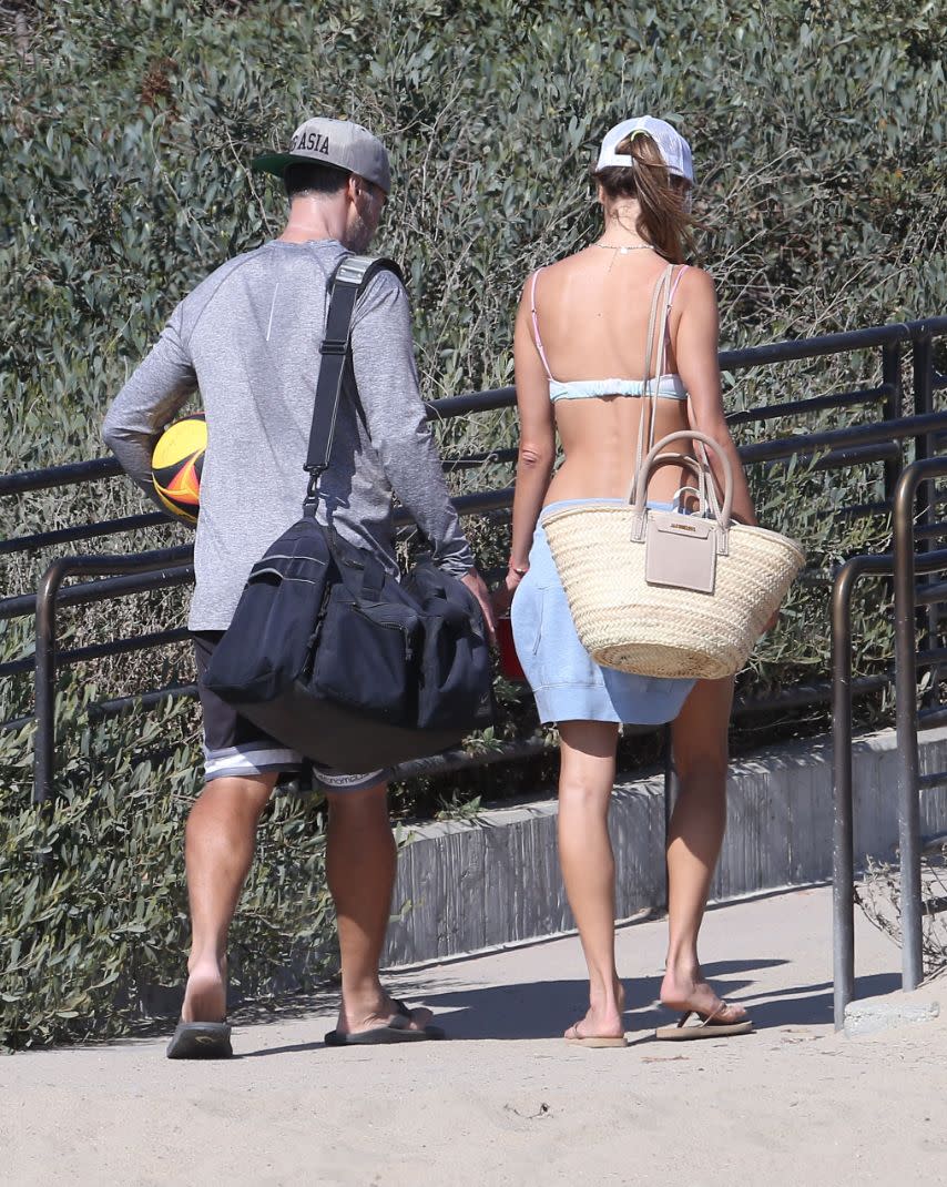 Alessandra Ambrosio and Richard Lee play a game of beach volleyball in Santa Monica, Calif., Sept. 18. - Credit: TheCelebrityfinder/MEGA