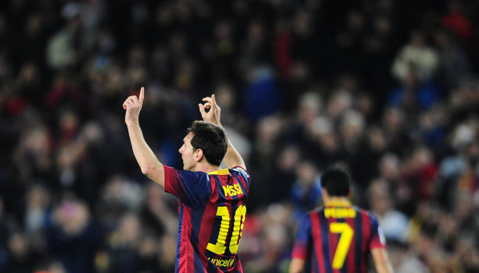 FC Barcelona's Lionel Messi, from Argentina, reacts after scoring against Rayo Vallecano during a Spanish La Liga soccer match at the Camp Nou stadium in Barcelona, Spain, Saturday, Feb. 15, 2014. (AP Photo/Manu Fernandez)