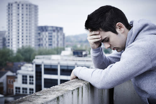   <span class="attribution"><a class="link " href="http://www.shutterstock.com/pic-423868981/stock-photo-depressed-young-man-contemplating-suicide-on-top-of-tall-building.html?src=pcUOdDsR9bVc3EIekVX6TA-1-1" rel="nofollow noopener" target="_blank" data-ylk="slk:SpeedKingz/Shutterstock.com;elm:context_link;itc:0;sec:content-canvas">SpeedKingz/Shutterstock.com</a></span>