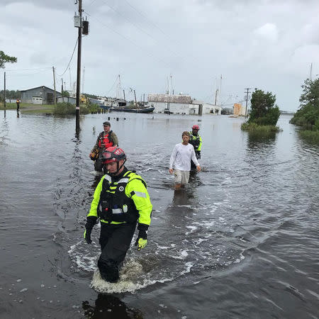 Urban Search and Rescue NY-TF1 Alpha team work with local officials to conduct wellness checks & an evacuation on Goose Creek Island in Pamlico County, North Carolina, U.S. September 15, 2018. NYC Emergency Management/Handout via REUTERS