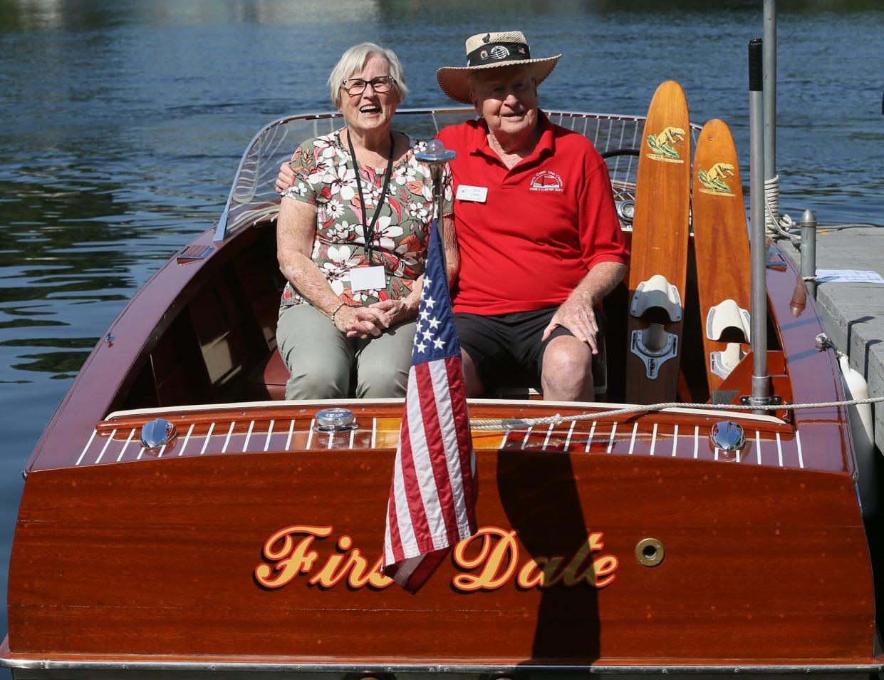 Portage Lakes couple Ginger and Bud Long sit for a portrait Saturday aboard their 1959 boat First Date. They went on their first date in 1962 on the boat, which belonged to her grandfather. They have been married for 56 years.