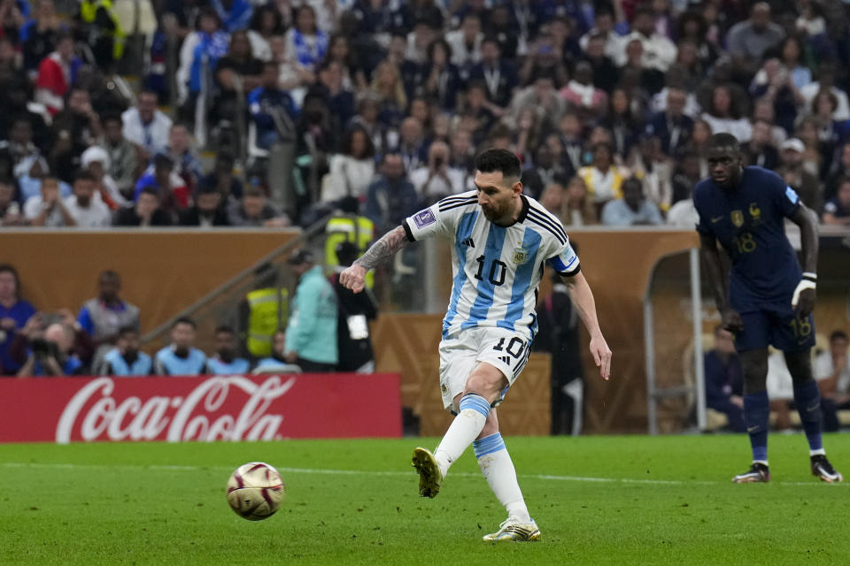 FILE - Argentina's Lionel Messi scores the opening goal from the penalty spot during the World Cup final soccer match between Argentina and France at the Lusail Stadium in Lusail, Qatar, on Dec. 18, 2022. Sotheby's is to auction off six first half shirts worn by Lionel Messi during Argentina's winning run at the soccer World Cup in Qatar in 2022, including the one in the final, and thinks they could become the most valuable collection of sports memorabilia ever sold at potentially more than $10 million. (AP Photo/Natacha Pisarenko, File)