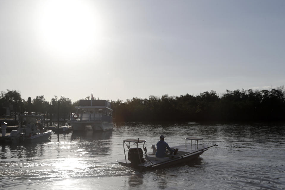 FILE - A boat heads out from the Flamingo boat ramp May 4, 2020, in Everglades National Park in Florida. Home-district projects for members of Congress are back, sprinkled across the government-wide $1.5 trillion bill President Joe Biden signed recently, including $350 million to help restore Florida’s vast but imperiled Everglades. (AP Photo/Lynne Sladky, File)