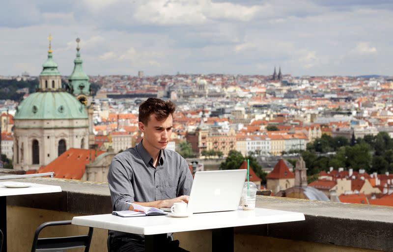 Joseph Petrila uses a laptop in Prague