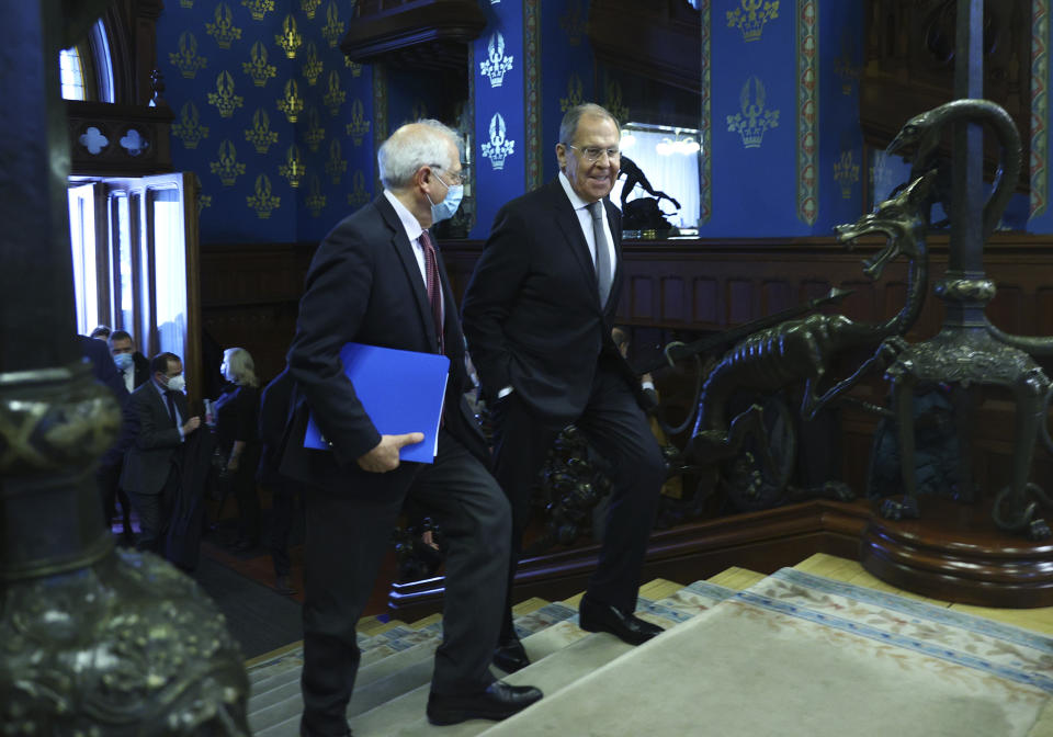 In this photo released by the Russian Foreign Ministry Press Service, Russian Foreign Minister Sergey Lavrov, right, and High Representative of the EU for Foreign Affairs and Security Policy, Josep Borrell walk during their meeting in Moscow, Russia, Friday, Feb. 5, 2021. (Russian Foreign Ministry Press Service via AP)