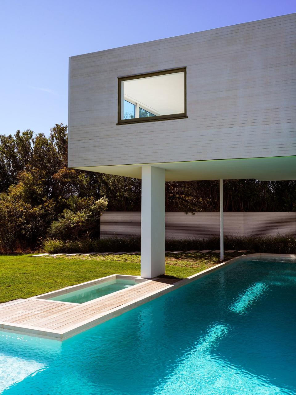 The Rice family renovated and re-clad their Montauk home, designed originally by architect Steven Harris, but didn’t touch the turquoise pool that flows under the primary suite. What was so successful, says Alexander, was “maintaining architectural integrity [while] really softening the edges with a seamless flow of hopefully effortless material transitions.”