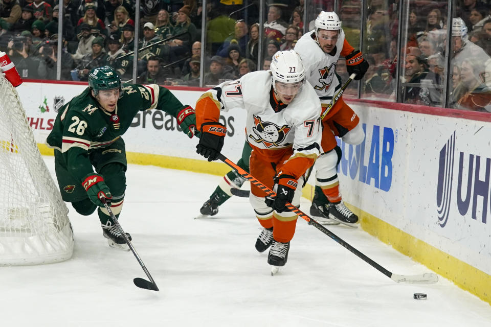 Anaheim Ducks right wing Frank Vatrano (77) skates past Minnesota Wild center Connor Dewar (26) during the second period of an NHL hockey game Saturday, Dec. 3, 2022, in St. Paul, Minn. The Wild win 5-4 in a shootout. (AP Photo/Craig Lassig)