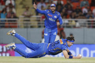 Mumbai Indians' Gerald Coetzee takes the catch to dismiss Punjab Kings' Liam Livingstone during the Indian Premier League cricket match between Punjab Kings' and Mumbai Indians' in Mullanpur ,India, Thursday, April 18, 2024.(AP Photo/ Surjeet Yadav))