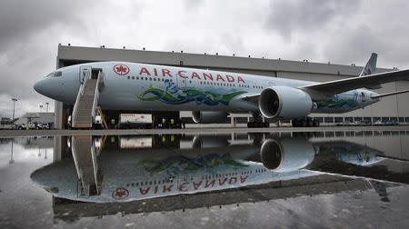 An Air Canada Boeing 777 painted in a 2010 Winter Olympic Games motive is unveiled in Vancouver, British Columbia July 8, 2009. REUTERS/Andy Clark