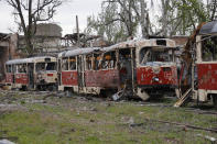 Destroyed trams stand in a depot in Mariupol, in territory under the government of the Donetsk People's Republic, eastern Ukraine, Saturday, May 21, 2022. (AP Photo/Alexei Alexandrov)