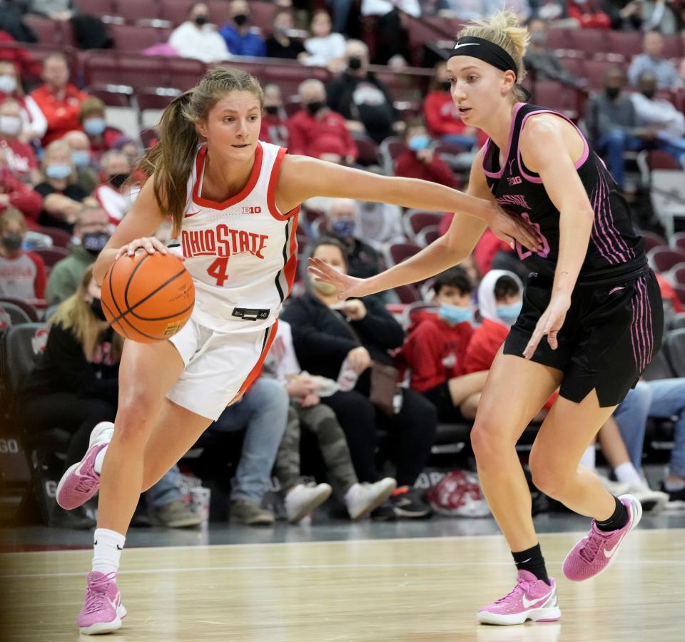 Ohio State Buckeyes guard Jacy Sheldon (4) is guarded by Penn State Nittany Lions guard Makenna Marisa (20) during Thursday's NCAA Division I women's basketball game on February 24, 2022, at Value City Arena in Columbus, Oh.
