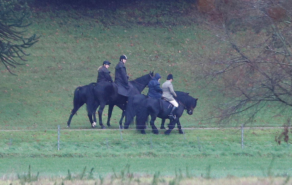 Prince Andrew (second from left) rides a horse on the grounds of Windsor Castle, alongside the queen on Friday. (Photo: REUTERS)
