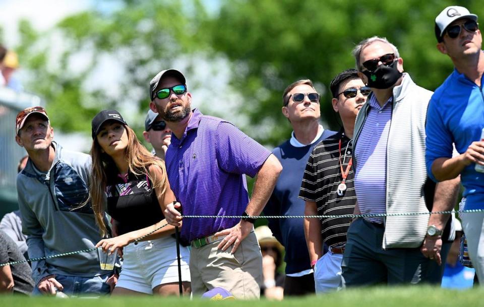 Fans watch the drives of players from the 17th tee box during first round action of the Wells Fargo Championship at Quail Hollow Club in Charlotte, NC on Thursday, May 6, 2021.