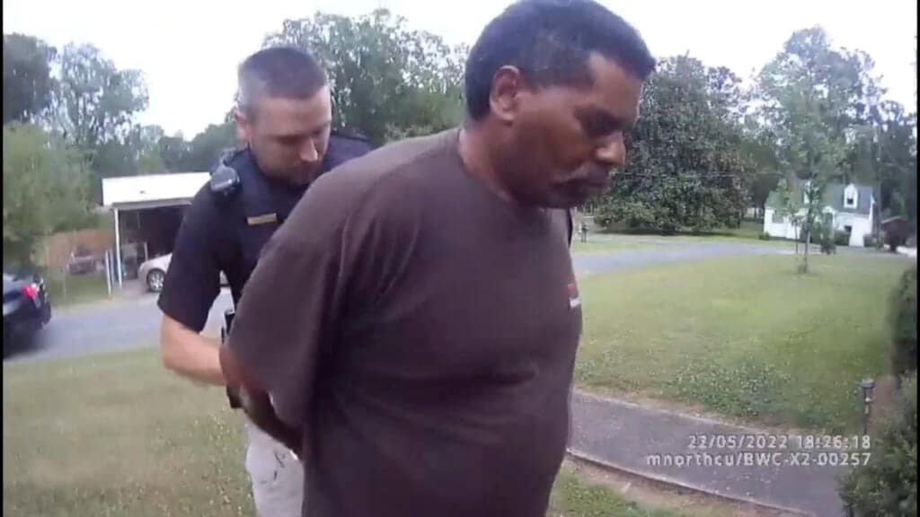 This image captured from bodycam video released by the Childersburg (Ala.) Police Department and provided by attorney Harry Daniels shows Michael Jennings, right, in custody in Childersburg, Ala., on Sunday, May 22, 2022. (Childersburg Police Department via AP)