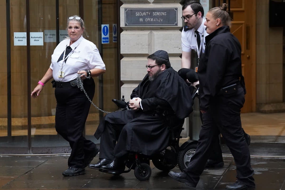 Nicholas Rossi told the court he is unable to raise his arms above his head (Andrew Milligan/PA) (PA Wire)