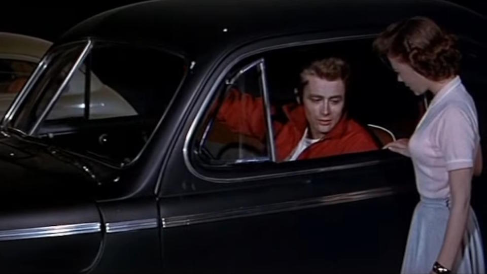 James Dean drives his family's car in Rebel Without a Cause