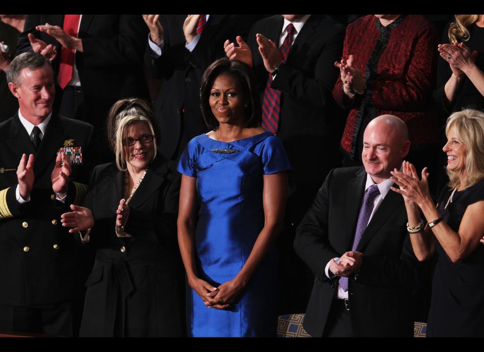 WASHINGTON, DC - JANUARY 24:  (L-R) U.S. Navy Vice Admiral William McRaven, Process Operator at the Siemens Charlotte Energy Hub Jackie Bray, First Lady Michelle Obama, Mark Kelly, former astronaut and husband of outgoing Arizona Rep. Gabrielle Giffords, and Dr. Jill Biden attend U.S. President Barack Obama's State of the Union address on January 24, 2012 in Washington, DC. Obama said the focal point his speech is the central mission of our country, and his central focus as president, including 'rebuilding an economy where hard work pays off and responsibility is rewarded.'  (Photo by Mark Wilson/Getty Images)