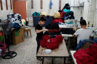 Syrian refugee boys work at a small textile factory in Gaziantep, where they are employed by a 30-year-old Turk who gave his name as Selim, in Turkey, May 16, 2016. REUTERS/Umit Bektas