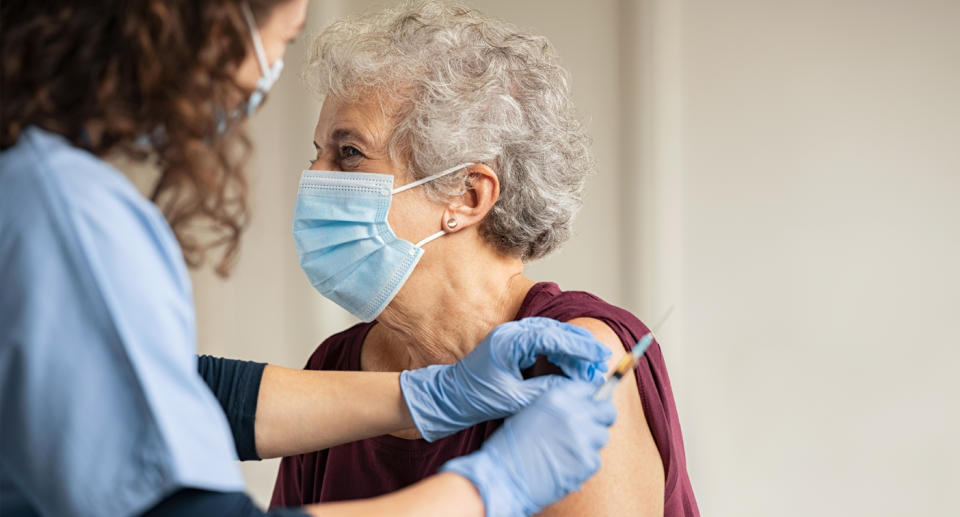 An elderly person receiving the Covid-19 vaccination 