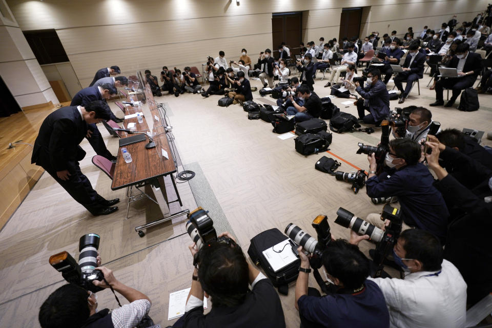 Koichiro Miyahara, second from left, President and CEO of Tokyo Stock Exchange, Inc. (TSE), and other officers bow during a press conference at the Tokyo Stock Exchange Thursday, Oct. 1, 2020, in Tokyo. Trading on the Tokyo Stock Exchange was suspended Thursday because of a problem in the system for relaying market information. Most other Asian markets were closed for national holidays. (AP Photo/Eugene Hoshiko)