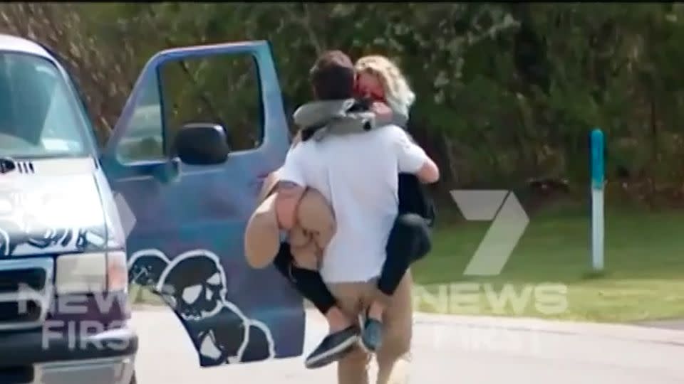 His girlfriend jumped into Reid's arms outside the jail. Source: 7 News