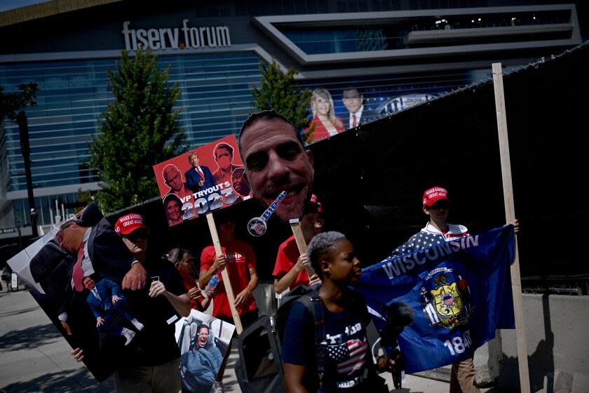 Supporters of former US President and 2024 Presidential hopeful Donald Trump hold signs outside the Fiserv Forum in Milwaukee, Wisconsin, on August 23, 2023, ahead of the first Republican Presidential primary debate. (Photo by Brendan SMIALOWSKI / AFP) (Photo by BRENDAN SMIALOWSKI/AFP via Getty Images)