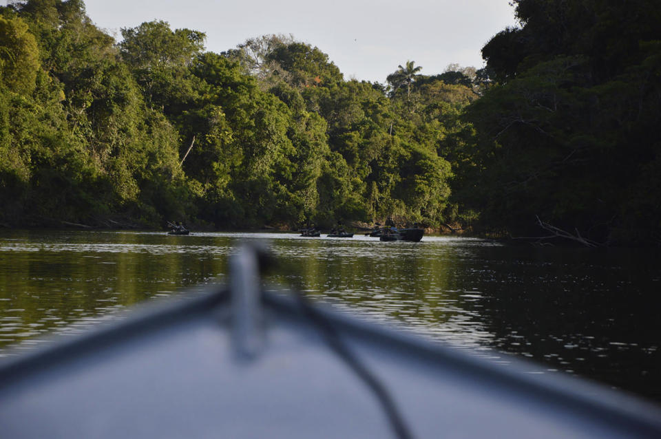 In this July 22, 2019 photo provided by Rodrigo Vargas, a boat moves through the in Cristalino II State Park in the state of Mato Grosso, in Brazil. In a move that shocked environmentalists, the government of Brazil's third-largest state gave up on a legal battle to protect the state park located in one of the Amazon's most biodiverse areas. Now the park will be officially dissolved, its press office confirmed to The Associated Press. (Rodrigo Vargas via AP)