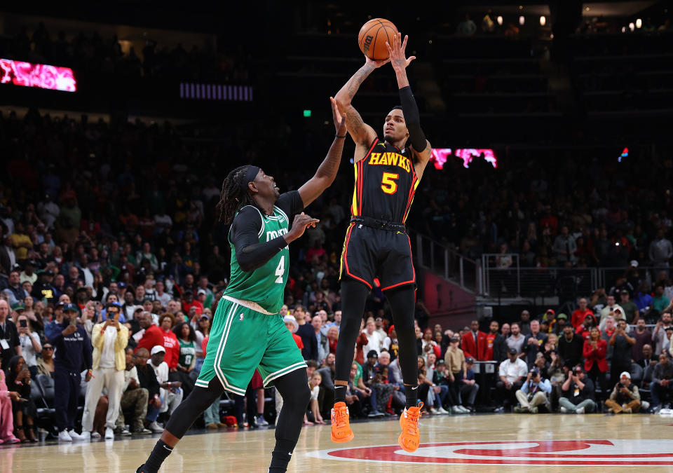 Dejounte Murray hits a game-winner over five-time All-Defensive team guard Jrue Holiday. (Kevin C. Cox/Getty Images)