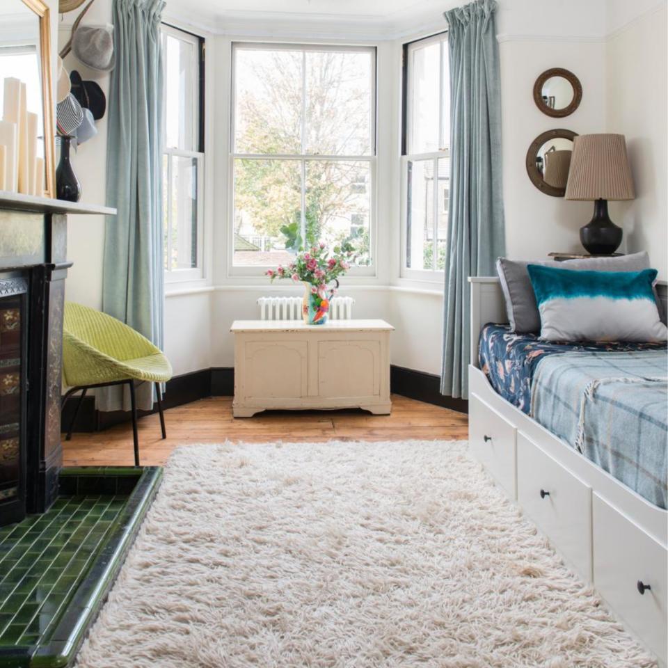 A cabin bed in a small bedroom