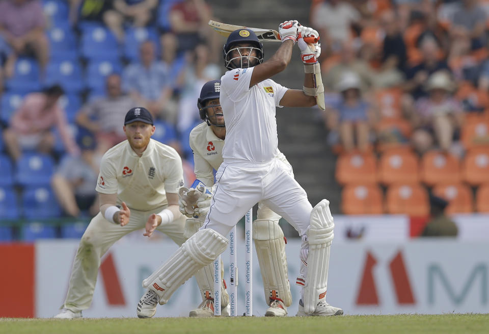 Sri Lanka's Dilruwan Perera plays a shot during the second day of the second test cricket match between Sri Lanka and England in Pallekele, Sri Lanka, Thursday, Nov. 15, 2018. (AP Photo/Eranga Jayawardena)