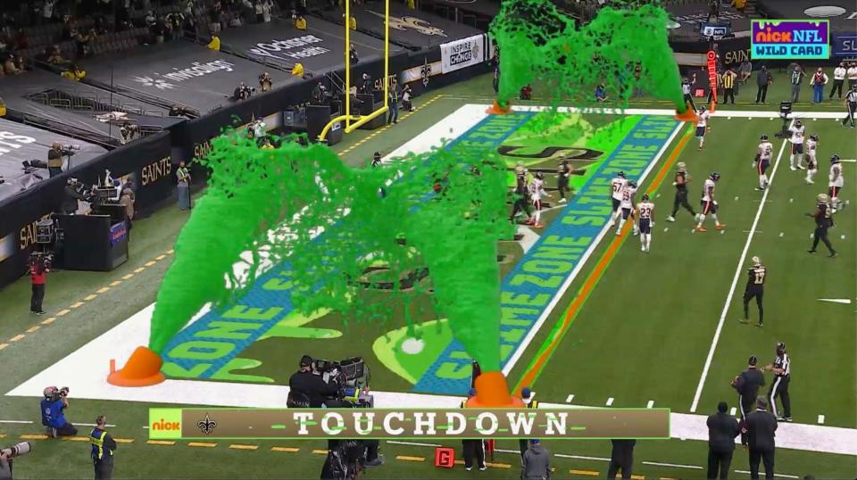 FILE - In this Jan. 10, 2021, file image, virtual slime cannons go off in the end zone after a touchdown during Nickelodeon's kid-focused broadcast of the NFL wild-card playoff game between the Chicago Bears and New Orleans Saints in New Orleans. There might eventually be a kids-focused broadcast of the Super Bowl. It won't be happening this year. Nickelodeon will still have a noticeable presence during Sunday's coverage on CBS.(CBS/Viacom via AP, File)