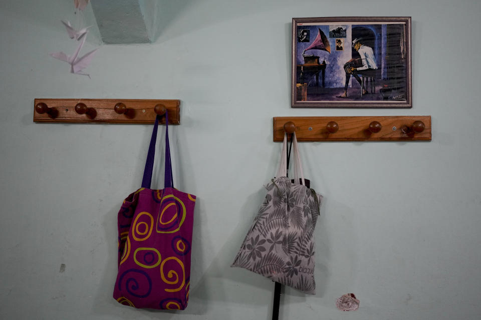 Retiree's bags hang on the sidelines of a bingo session at the Caballito and Villa Crespo, a recreational day center for retirees, in Buenos Aires, Argentina, Wednesday, April 12, 2023. With inflation at 7.7% in March, keeping the year-on-year measurement above 100%, millions of retirees face the dilemma of whether to eat, take medication or pay the rent since their pensions do not cover a third of their bills. (AP Photo/Natacha Pisarenko)