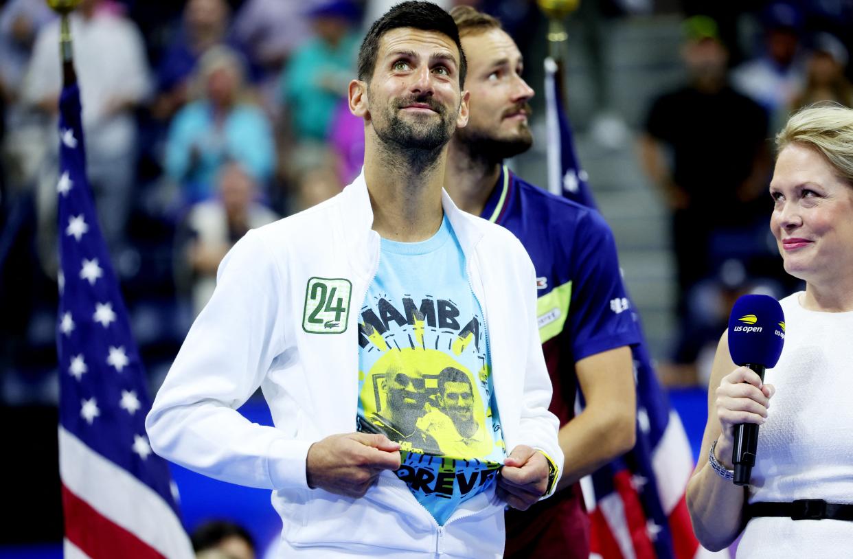 Novak Djokovic celebrates while wearing a shirt with an image of Kobe Bryant (REUTERS)