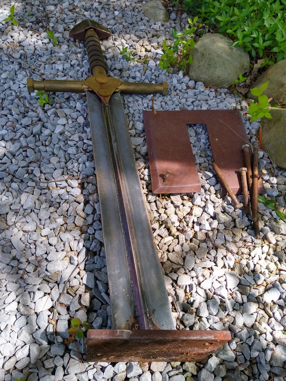 The sword no longer has a stump. The Excalibur sculpture at West Exchange Street and Elmdale Avenue in Akron was taken down so its stump could be removed.