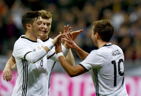 Football Soccer - Germany v Italy - International Friendly - Allianz-Arena, Munich, Germany - 29/3/16 Germany's Mario Goetze celebrates with team mates after scoring the second goal against Italy REUTERS/Michaela Rehle