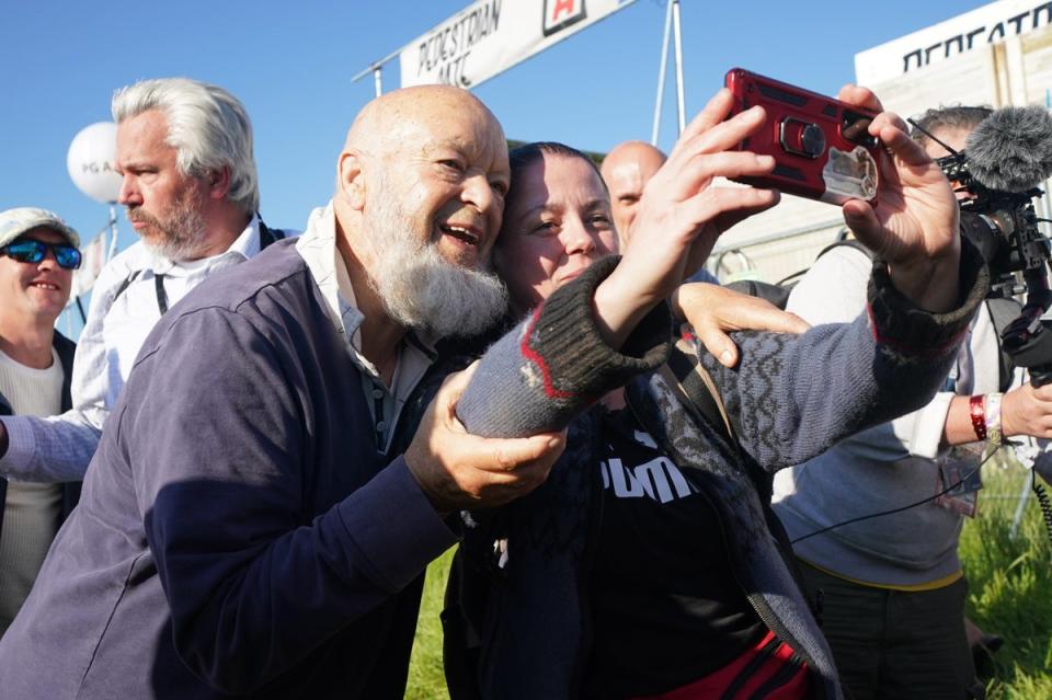 Michael Eavis has a selfie with a festival-goer (Yui Mok/PA) (PA Wire)