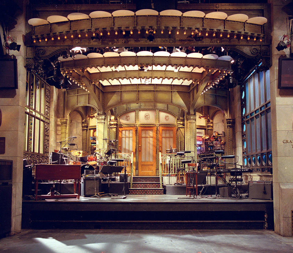 Stage set of the iconic television show "Saturday Night Live" (SNL), featuring musical instruments and equipment prepared for a performance