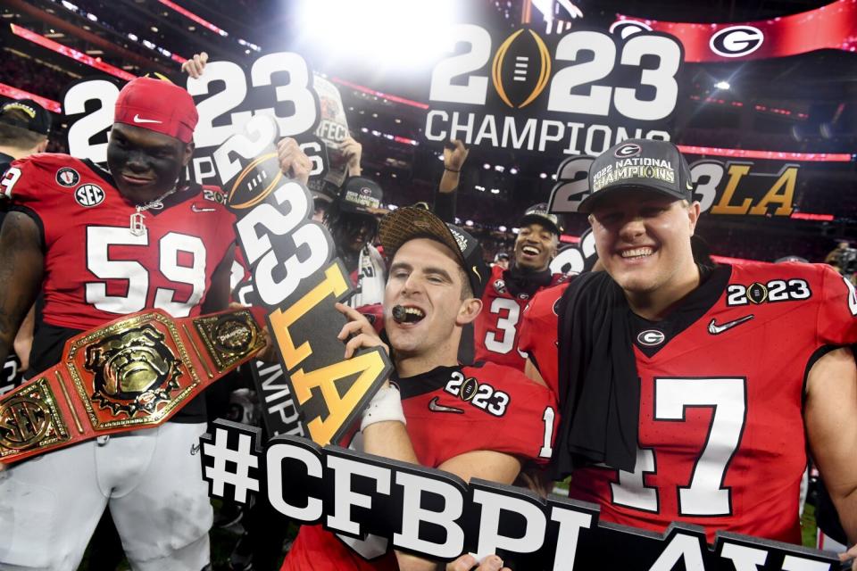 Georgia players, including Broderick Jones, Stetson Bennett and Payne Walker, celebrate at SoFi Stadium.