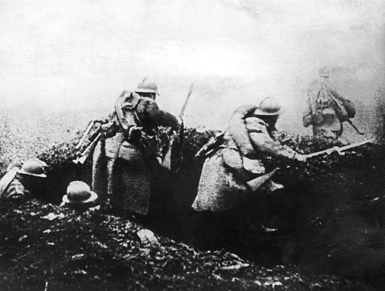 A picture taken in 1916 shows French soldiers moving into attack from a trench during the Battle of Verdun in eastern France during World War I