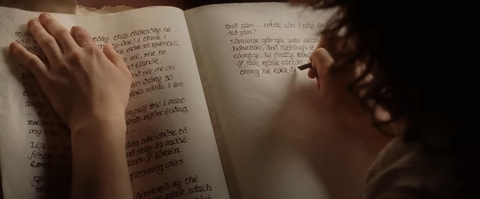 frodo writing his book in the return of the king